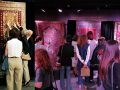 Visitors viewing Armenian carpets at the Lark Musical Society exhibition
